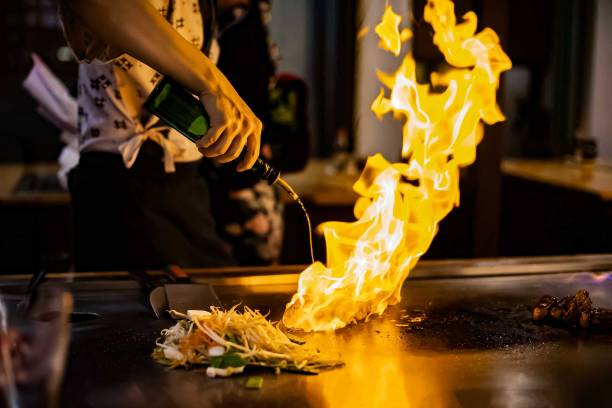 teppan-show-at-a-traditional-japanese-restaurant-hands-of-the-cook-japanese-cook-prepares